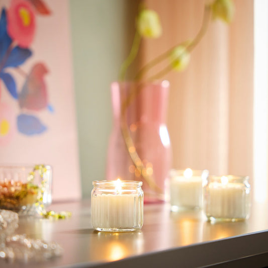 HÖKGÖK scented candle in glass, Vanilla pale beige, 12 hr