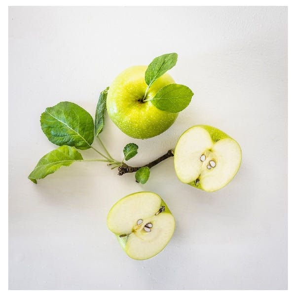 Ikea LÖVSKOGSLUND - Scented candle in glass, apple/light green, 12 hr