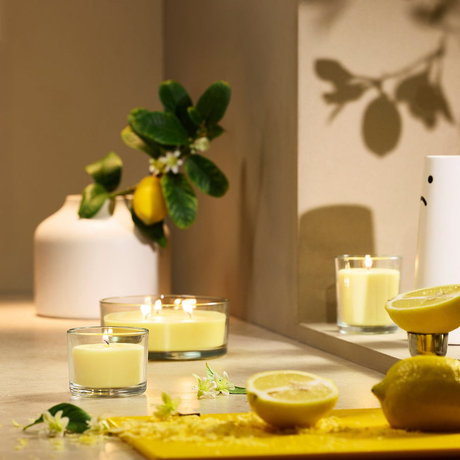 LOTSFÅGEL scented candle in glass, Citrus flower light yellow, 40 hr