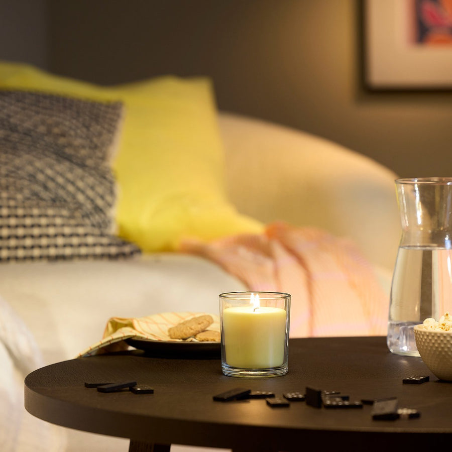 LOTSFÅGEL scented candle in glass, Citrus flower light yellow, 40 hr