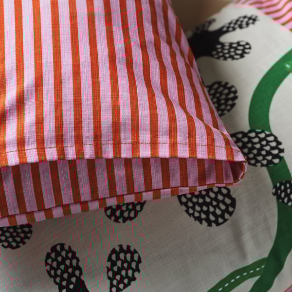 MÄVINN cushion cover, off-white black/floral pattern, 40x58 cm