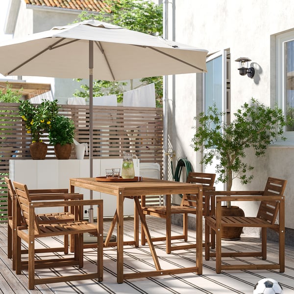 NÄMMARÖ table+4 chairs w armrests, outdoor, light brown stained, 140 cm