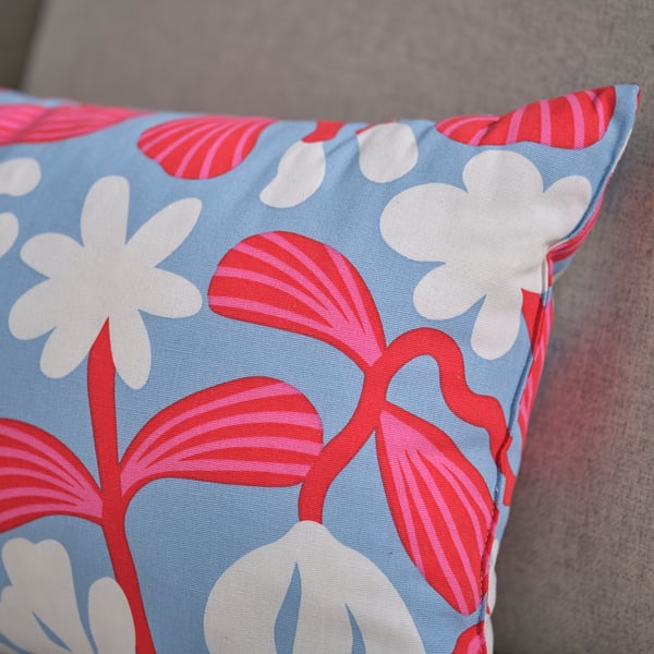 SANDMOTT cushion, light blue/bright red, 30x58 cm