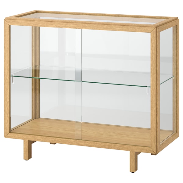 STOCKHOLM 2025 glass-door cabinet, oak veneer, 100x40x86 cm