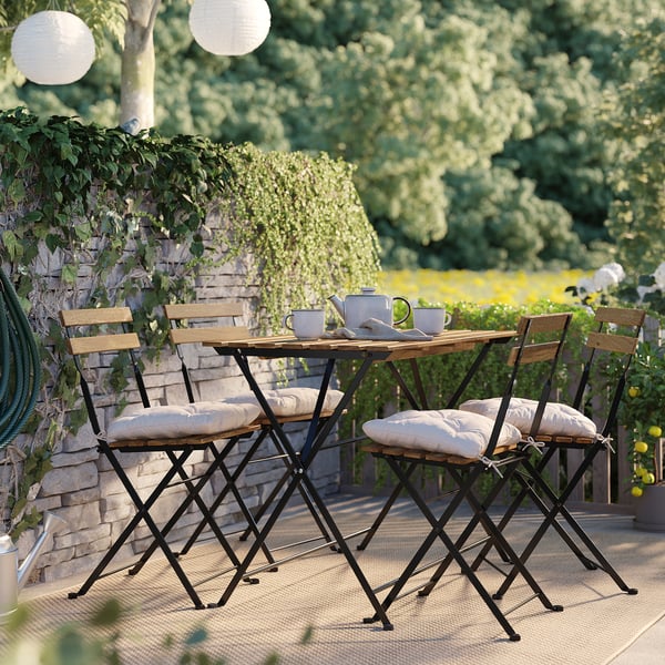 TÄRNÖ table+4 chairs, outdoor, black/light brown stained foldable/foldable Kuddarna light grey-beige, 100x54 cm