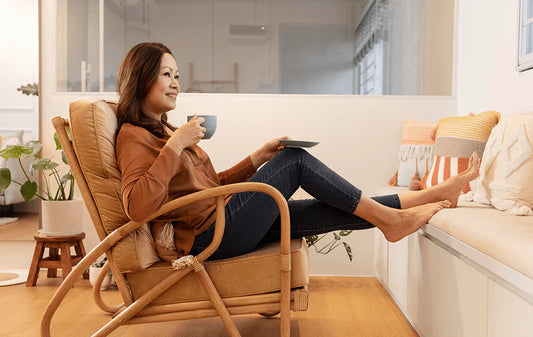 Blissful woman relaxing with essential oils