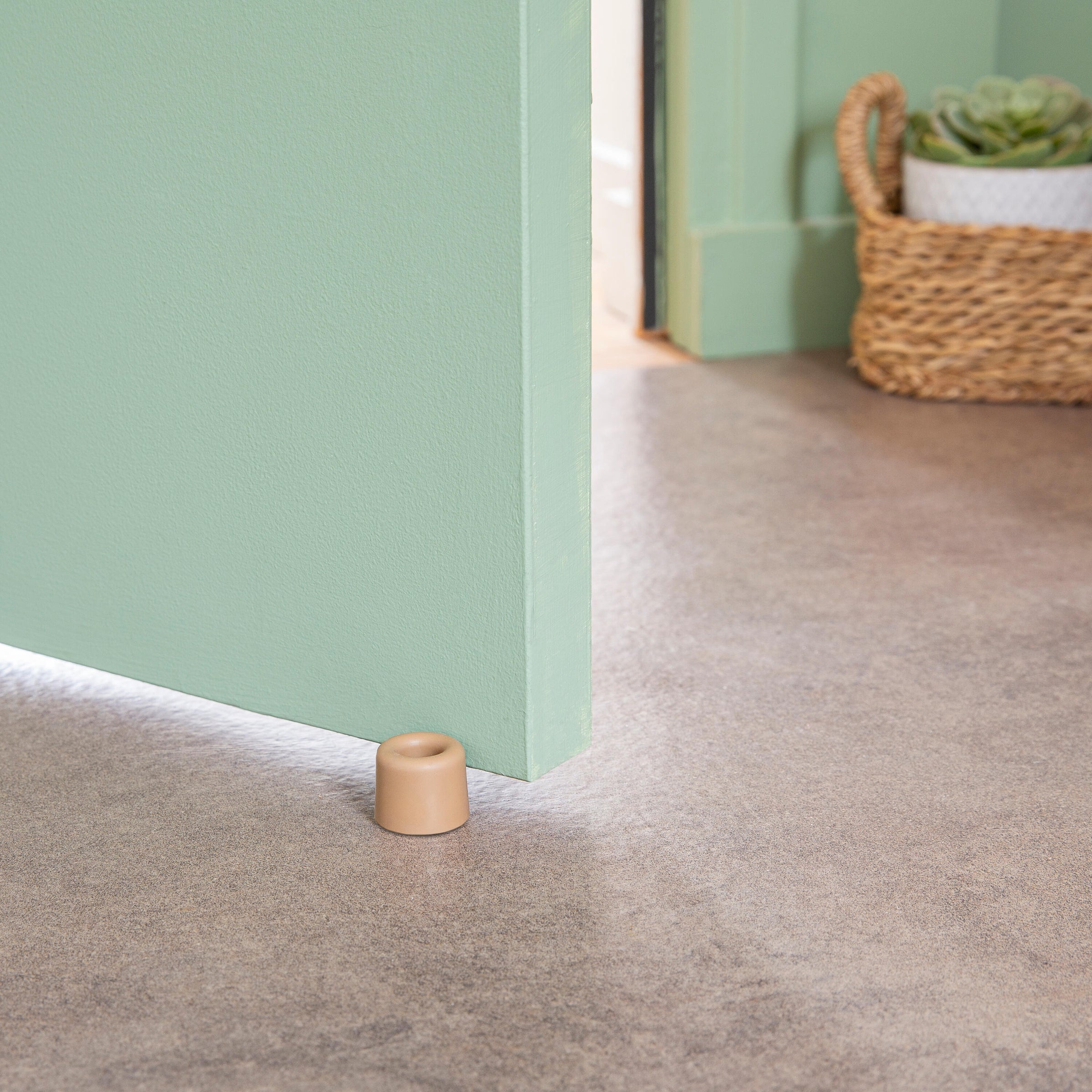 VULCANISED RUBBER DOORSTOP WITH DOUBLE FASTENING MATT BROWN D 3 X H 2.5 CM