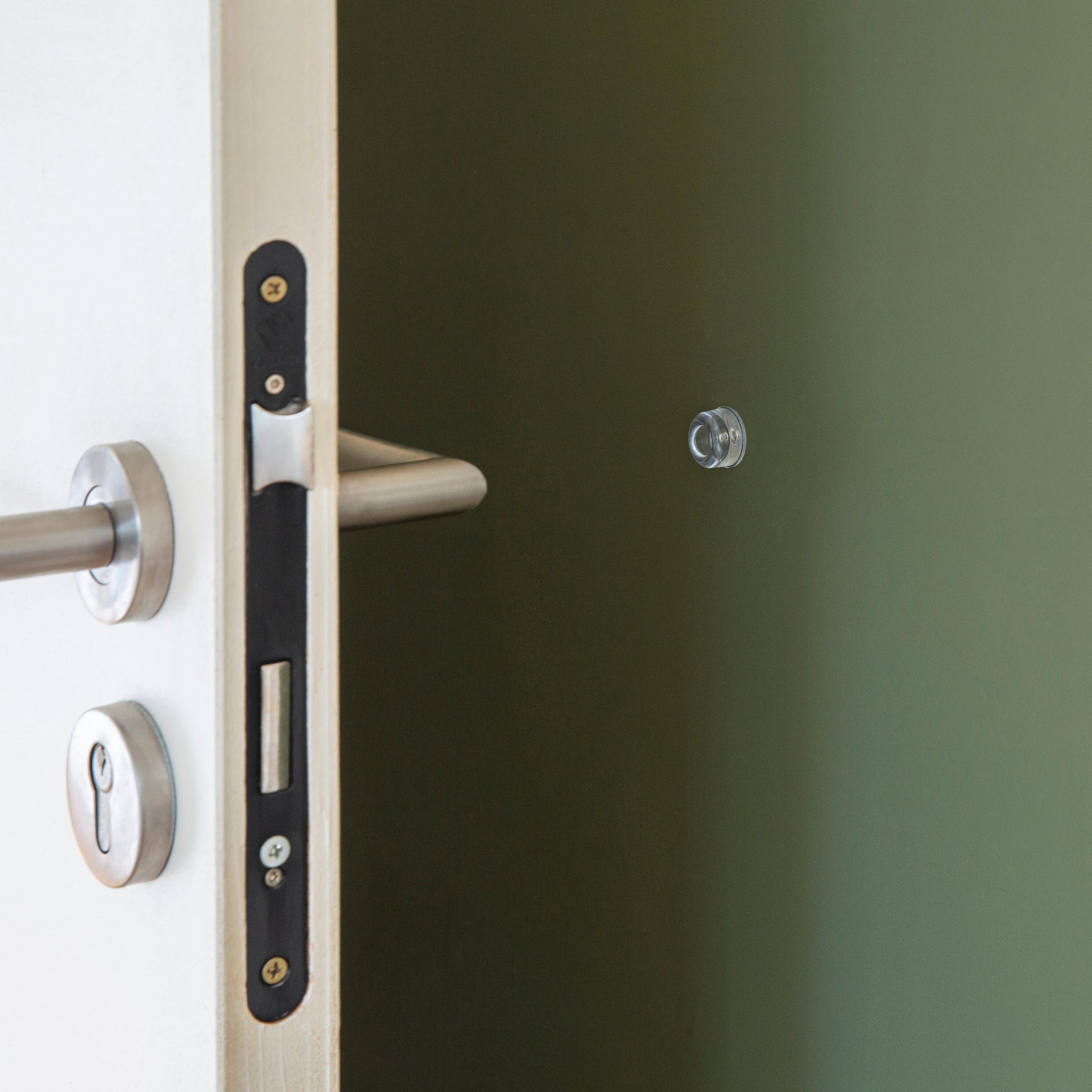 CLEAR PVC ADHESIVE DOORSTOP OP