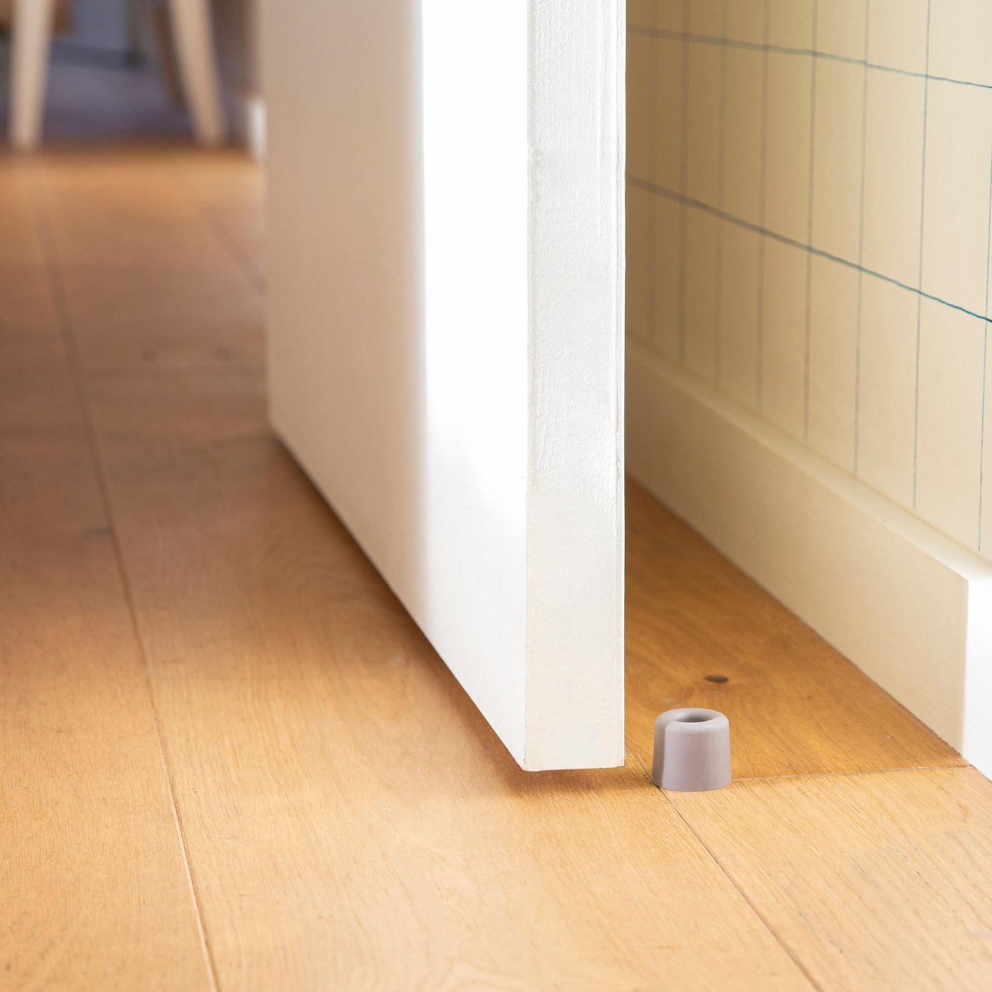 VULCANISED RUBBER DOORSTOP WITH DOUBLE FASTENING GREY D 3 X H 2.5 CM