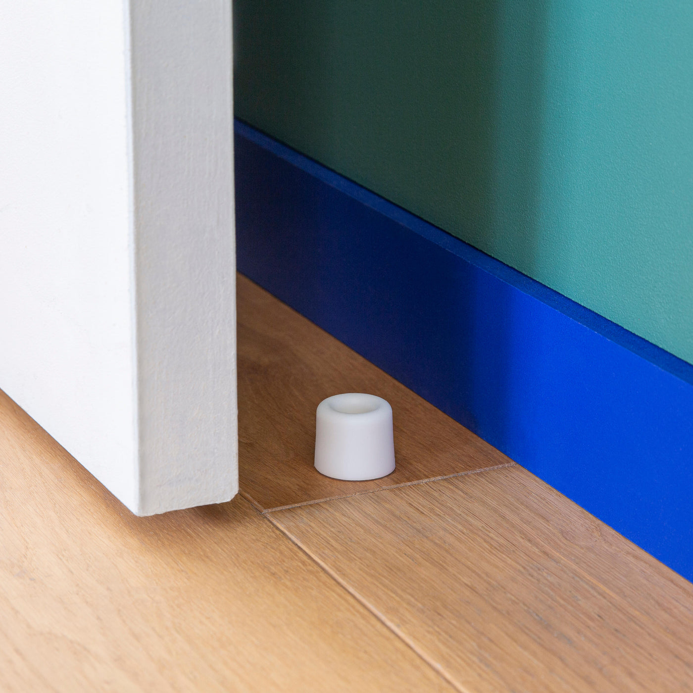VULCANISED RUBBER DOORSTOP WITH DOUBLE FASTENING WHITE D 3 X H 2.5 CM