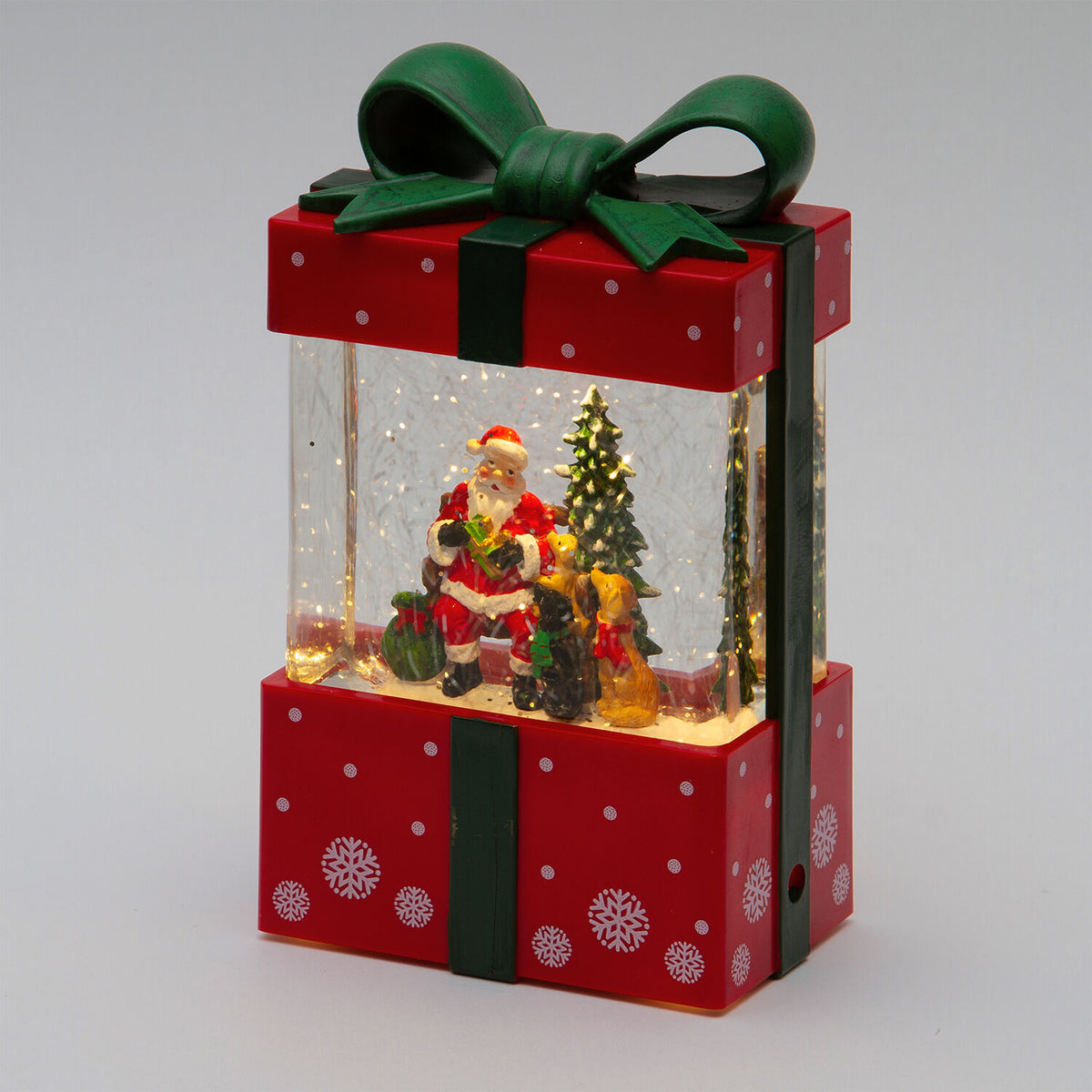 Pacco regalo rosso glitter 11x7xh19cm con led bianco caldo, movimento acqua e musica natal