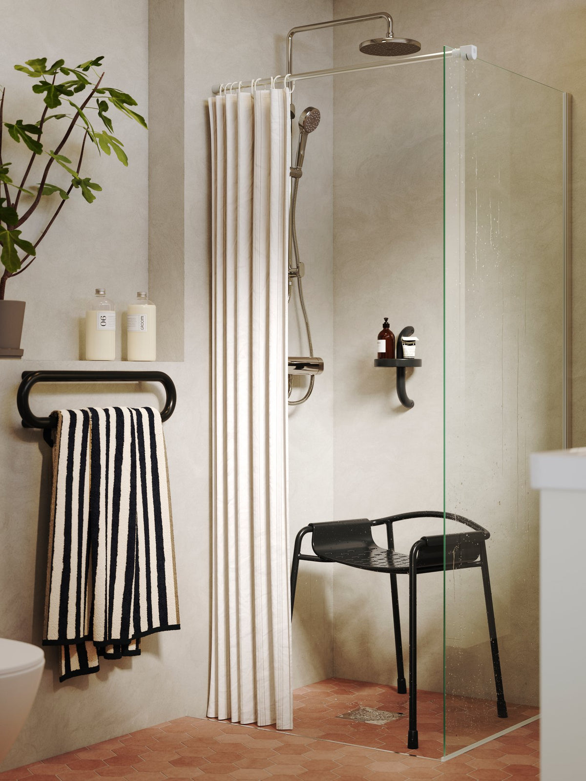 A bathroom with natural tones and dark contrasts