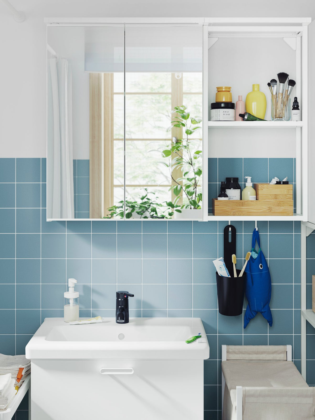 A fresh white and blue bathroom-laundry combination
