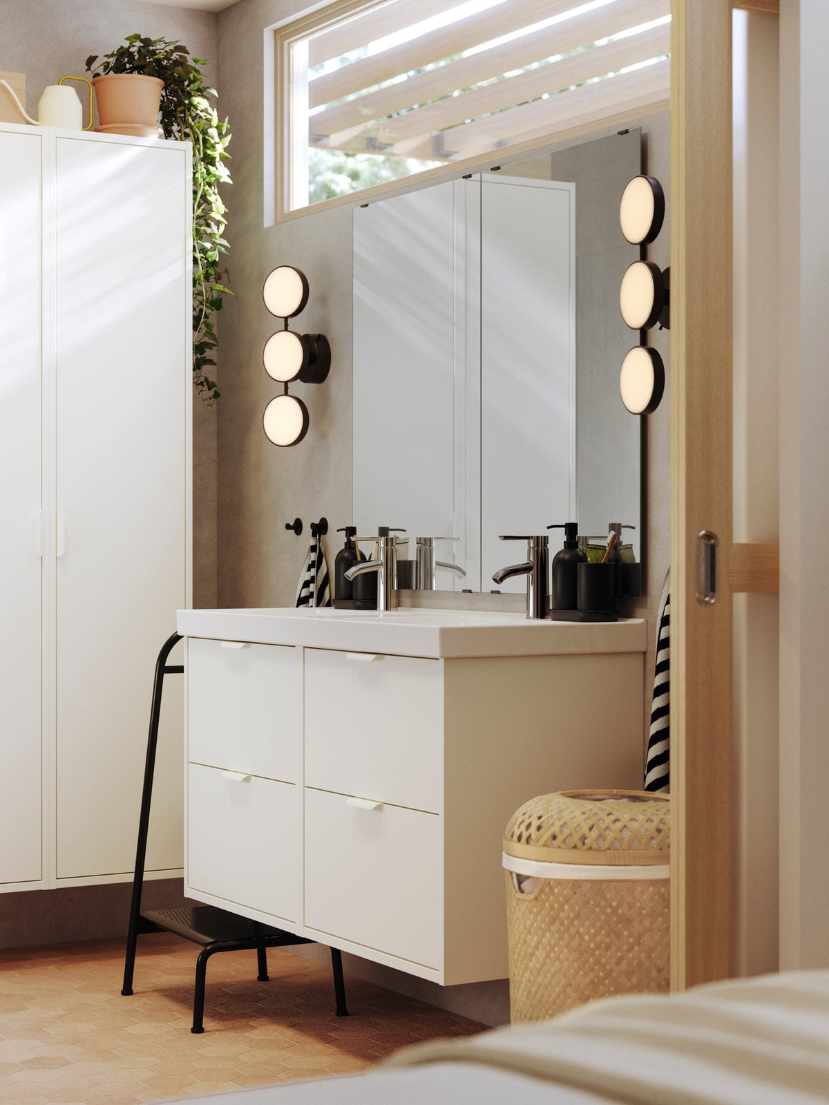A bathroom with natural tones and dark contrasts