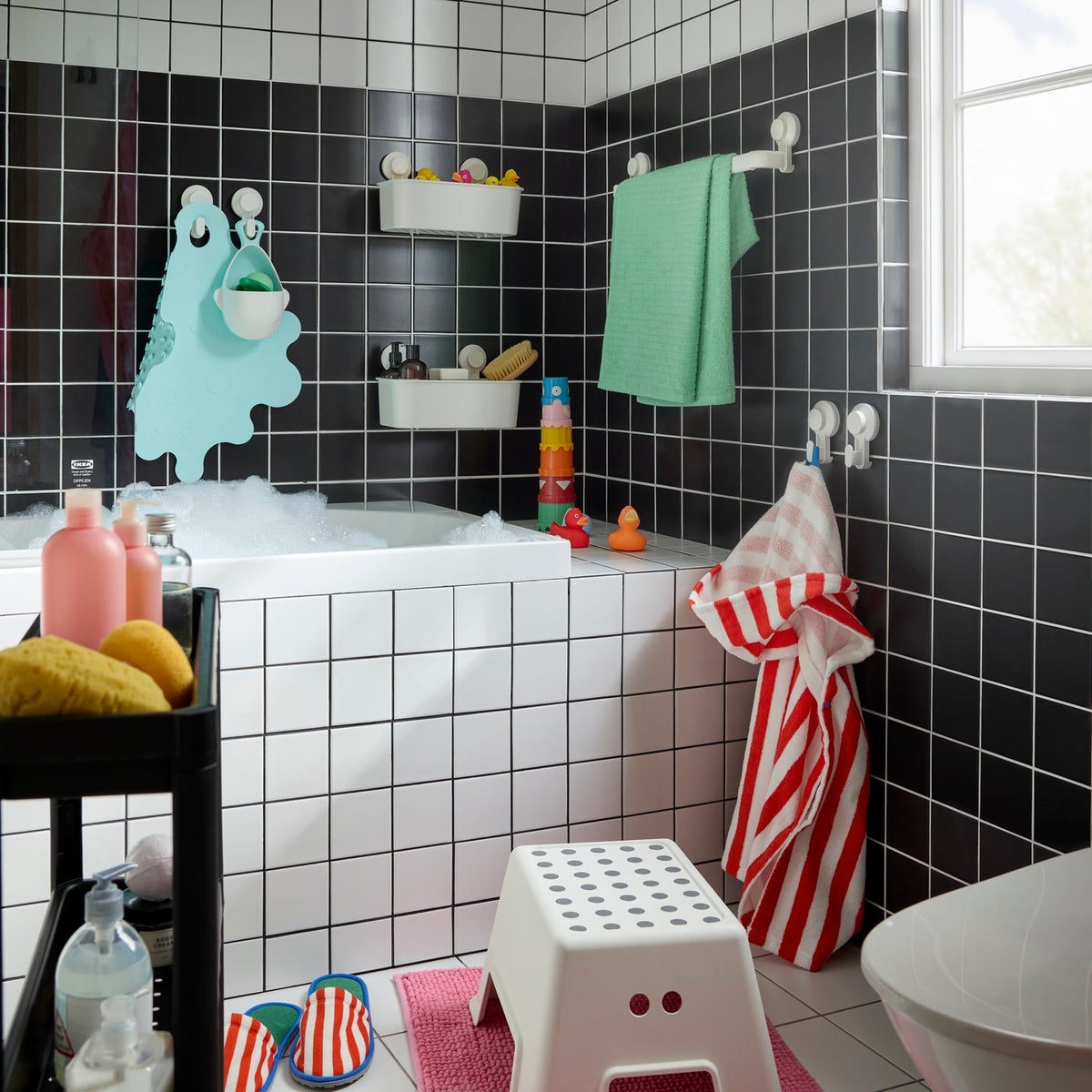 A cheerful black and white family bathroom