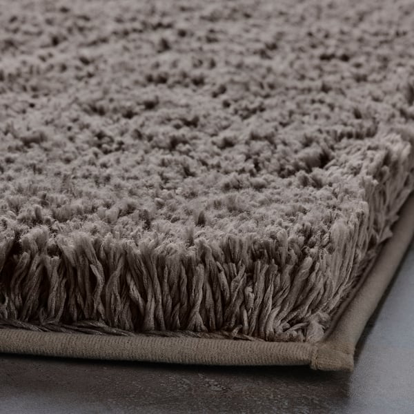 ALMTJÄRN bath mat, beige, 60x90 cm