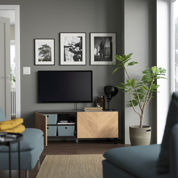 BESTÅ - TV bench with doors, black-brown/Hedeviken/Stubbarp oak veneer, 120x42x48 cm