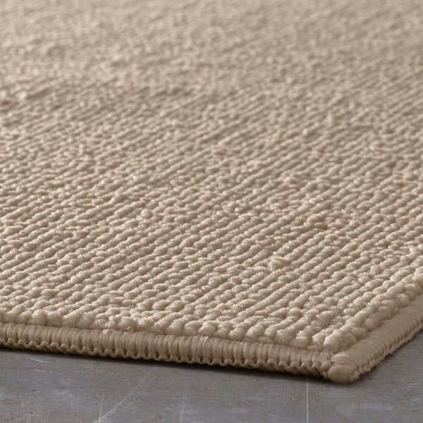 FINTSEN bath mat, beige, 40x60 cm