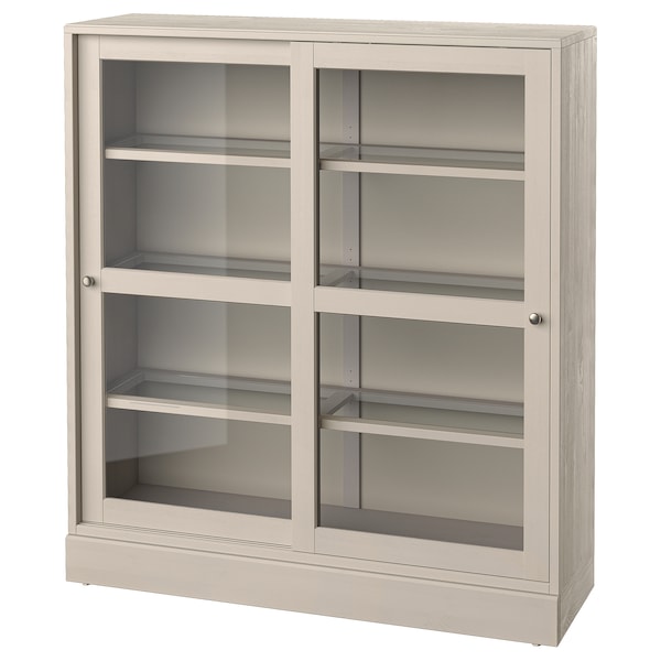 HAVSTA - Glass-door cabinet with plinth, grey-beige/clear glass, 121x37x134 cm