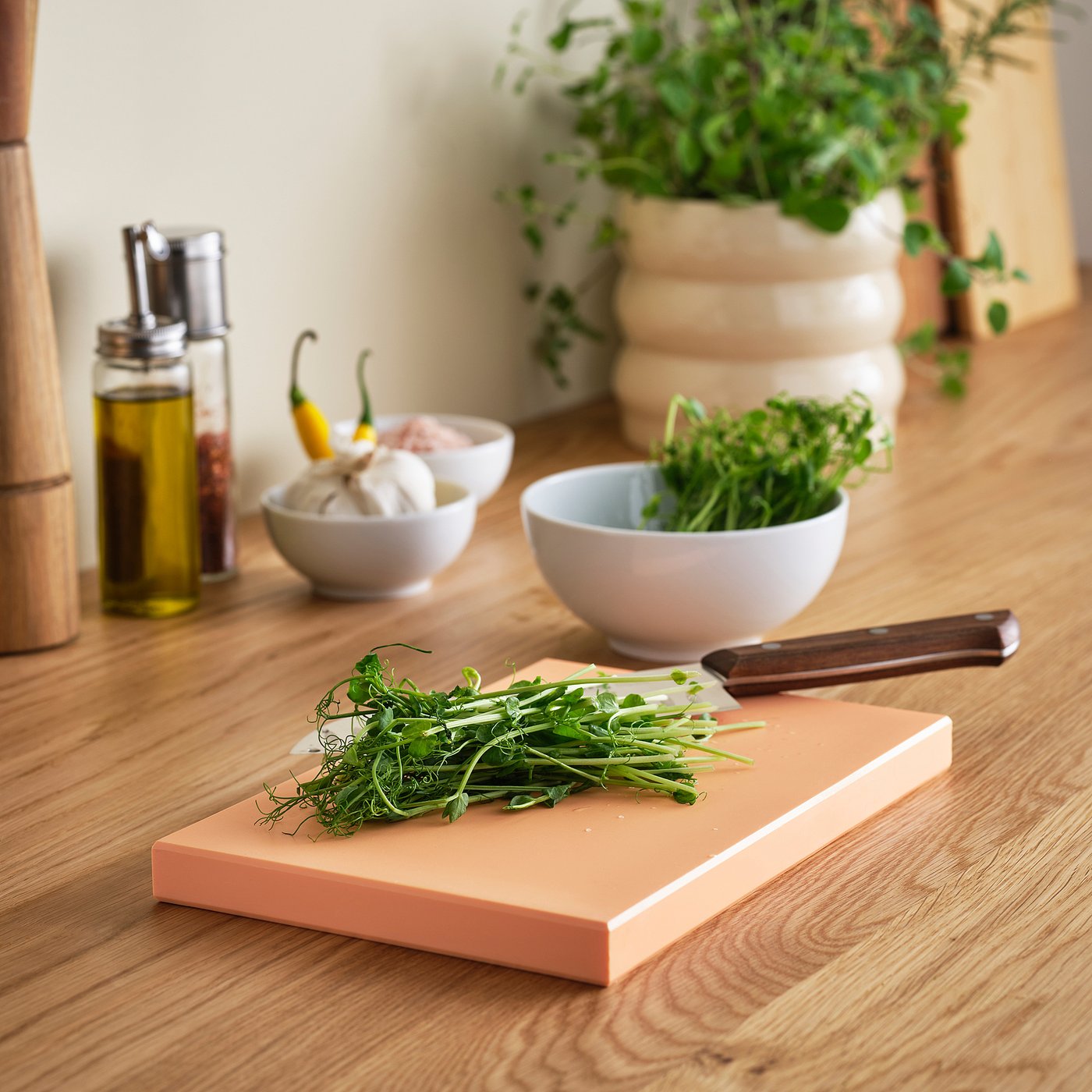 KUSTHOPPARE chopping board, light orange, 25x17 cm