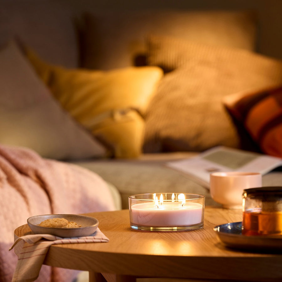 LOTSFÅGEL scented candle in glass, 3 wicks, Pink flowers pale pink, 15 cm