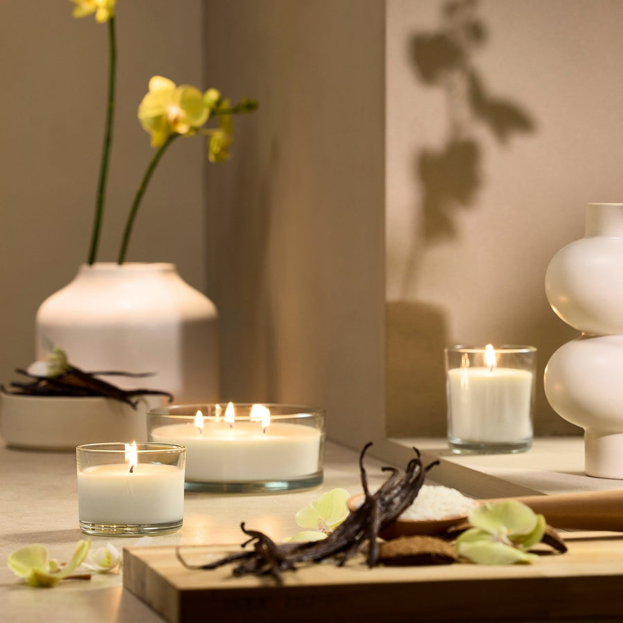 LOTSFÅGEL scented candle in glass, 3 wicks, Vanilla pale beige, 15 cm