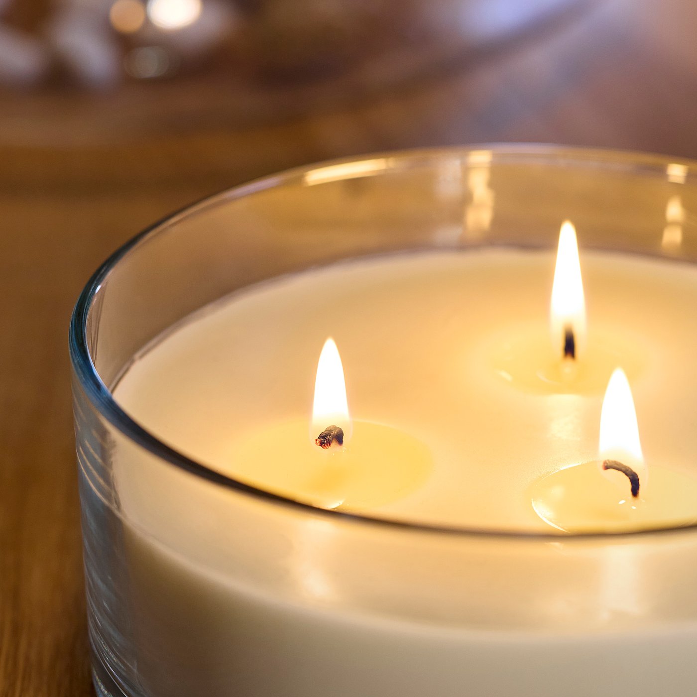 LOTSFÅGEL scented candle in glass, 3 wicks, Vanilla pale beige, 15 cm