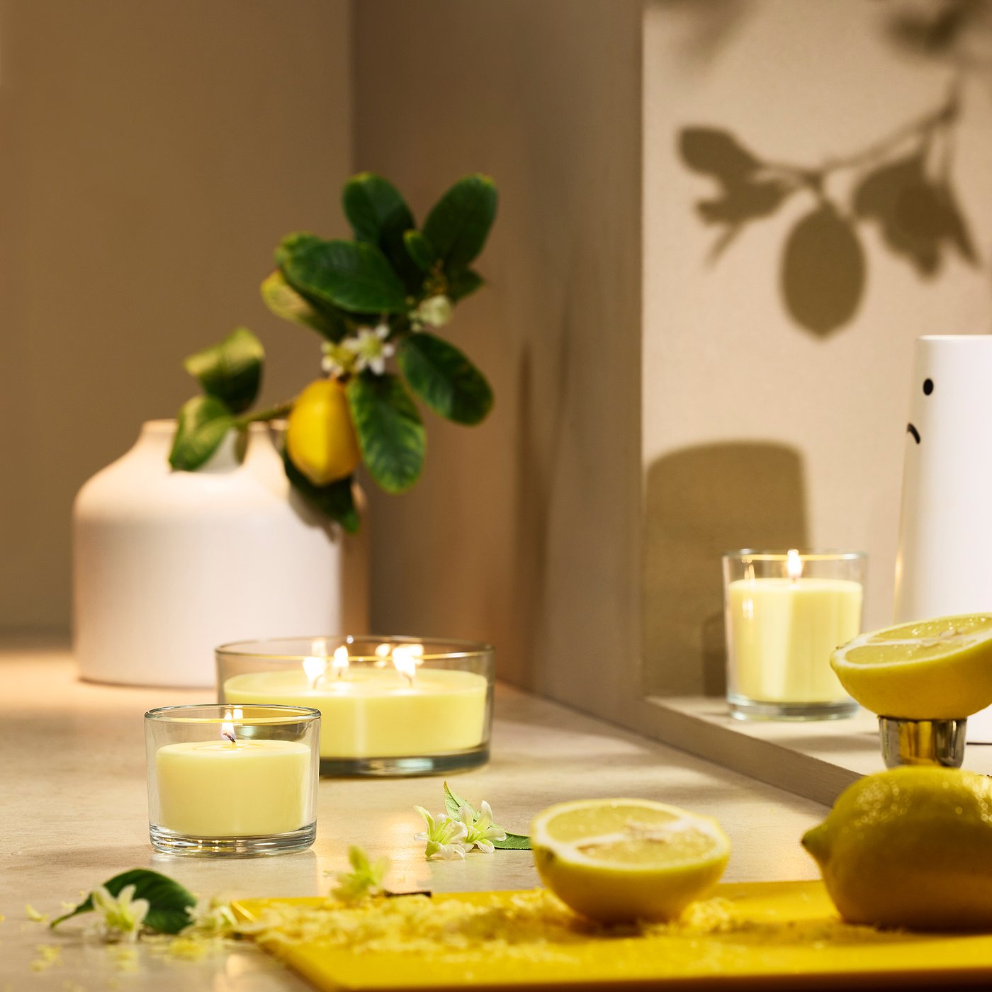 LOTSFÅGEL scented candle in glass, Citrus flower light yellow, 40 hr