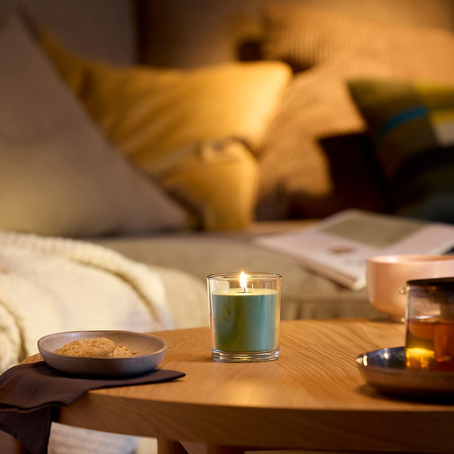 LOTSFÅGEL scented candle in glass, Fig leaf green, 8 cm