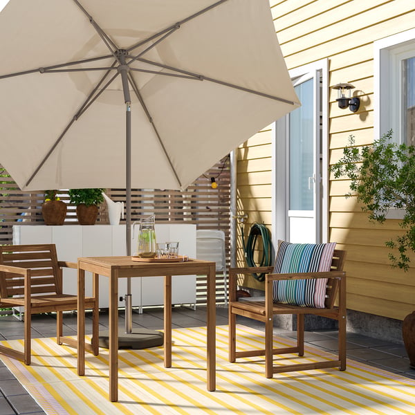 NÄMMARÖ table+2 chairs w armrests, outdoor, light brown stained, 75 cm