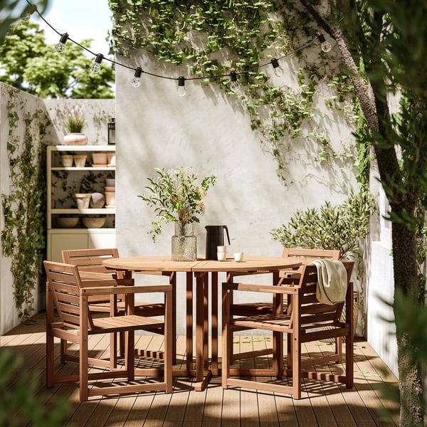 NÄMMARÖ table+4 chairs w armrests, outdoor, light brown stained, 130 cm