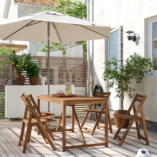 NÄMMARÖ table+4 folding chairs, outdoor, light brown stained, 140 cm