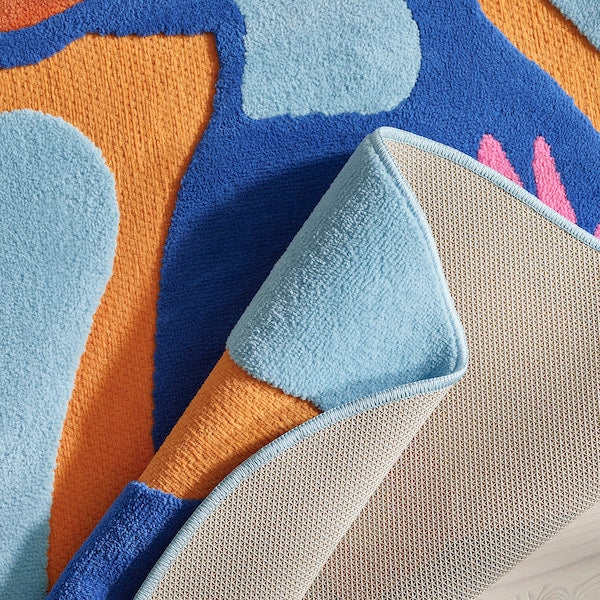 NATTHÄGER rug, low pile, blue orange/toucan, 83x125 cm
