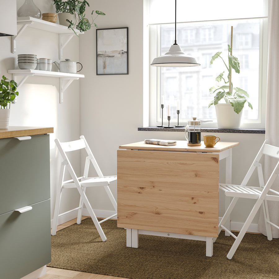 PINNTORP / FRÖSVI table and 2 folding chairs, light brown stained white/pine white, 67/124x75 cm