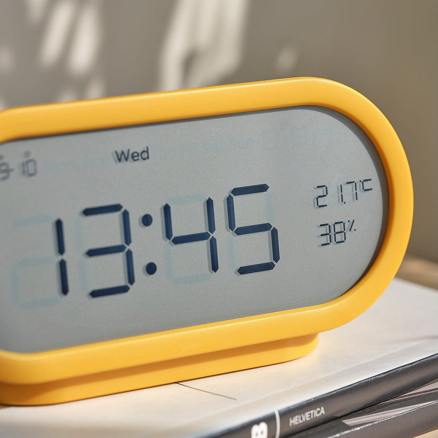 RÖDSTRÄFSE alarm clock with hygro-/thermometer, yellow, 17x8x6 cm