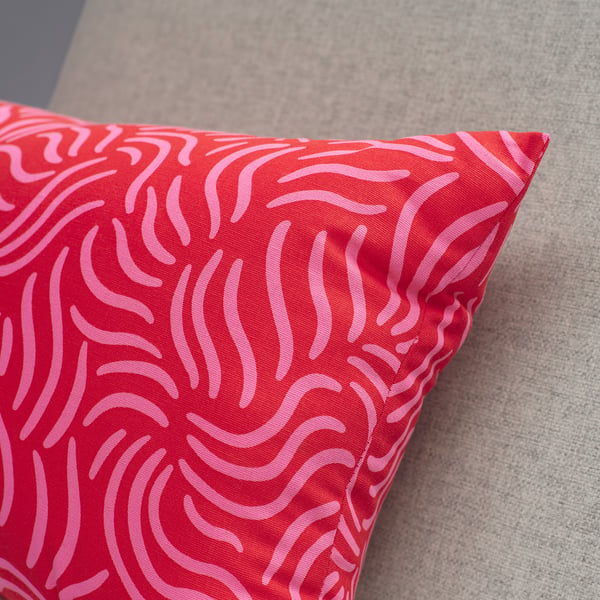 SANDMOTT cushion, bright red/bright pink, 30x58 cm