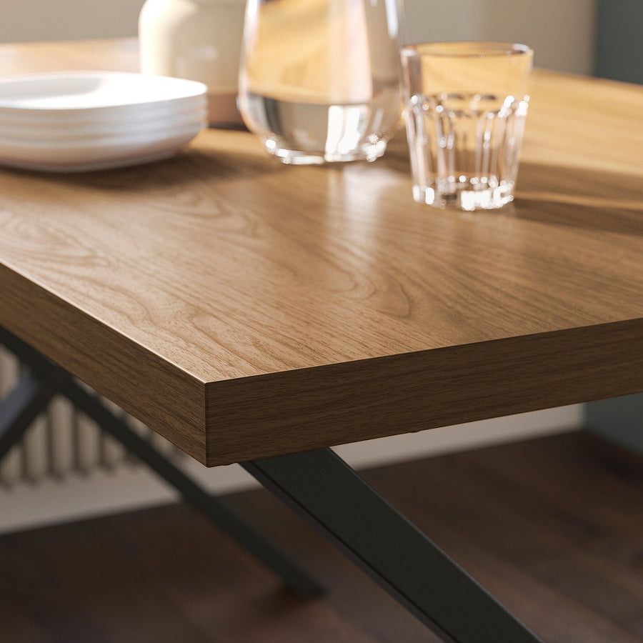 SKÅLSTA table and 4 chairs, walnut effect X-shaped black-grey/walnut veneer profiled metal/black-grey, 140x80 cm