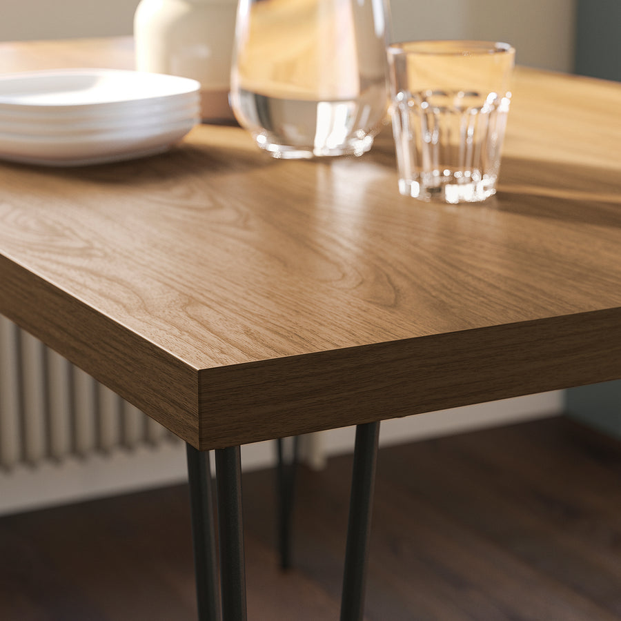 SKÅLSTA table and 4 chairs, walnut effect hairpin black-grey/plastic black tubular metal/black-grey, 140x80 cm