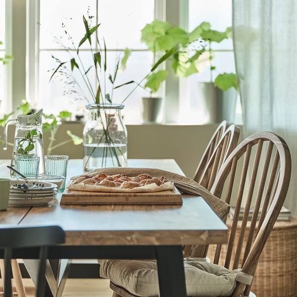 SKOGSTA dining table, acacia/black, 235x100 cm