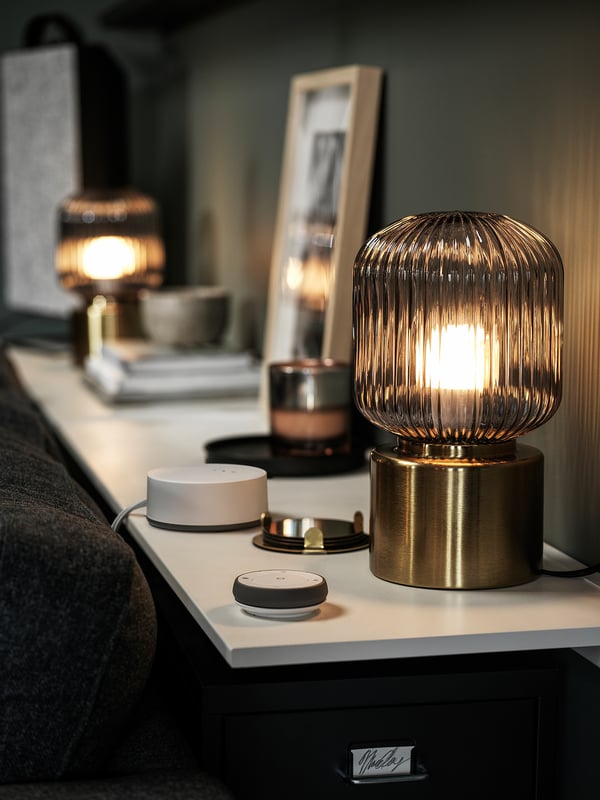 SOLKLINT table lamp, brass/grey clear glass, 28 cm