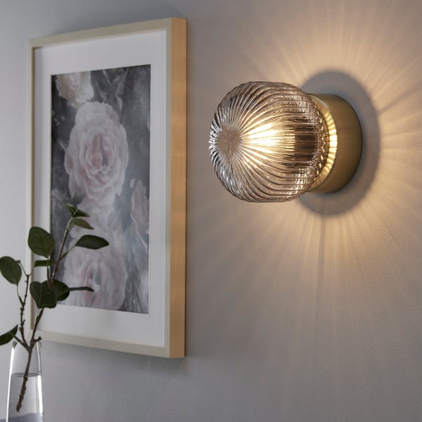 SOLKLINT wall lamp, wired-in installation, brass/grey clear glass, 16 cm