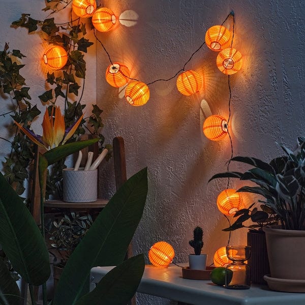 Ikea SOLVINDEN - Illuminazione a LED 12 luci, da esterno/a batterie arancione