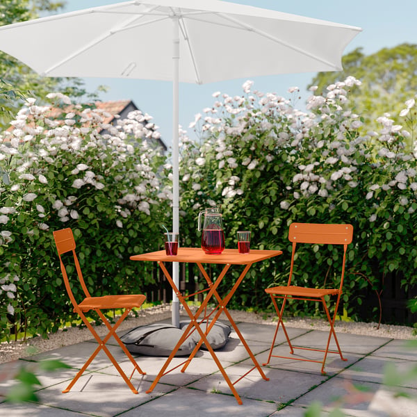 SUNDSÖ table and 2 folding chairs, outdoor bright orange/bright orange, 65x65 cm