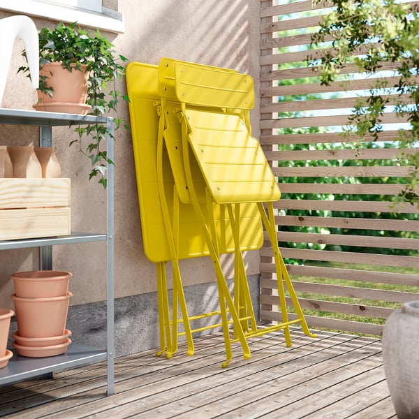 SUNDSÖ table and 2 folding chairs, outdoor bright yellow/bright yellow Kuddarna light grey-beige, 65x65 cm