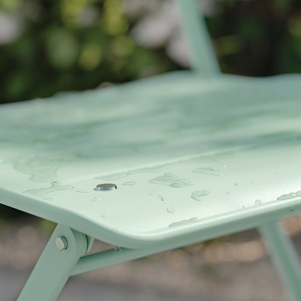 SUNDSÖ table and 2 folding chairs, outdoor light green/light green Kuddarna light grey-beige, 65x65 cm