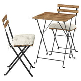 TÄRNÖ table+2 chairs, outdoor, black/light brown stained foldable/foldable Kuddarna light grey-beige, 55x54 cm