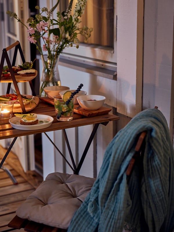 TÄRNÖ table+4 chairs, outdoor, black/light brown stained foldable/foldable Kuddarna light grey-beige, 100x54 cm