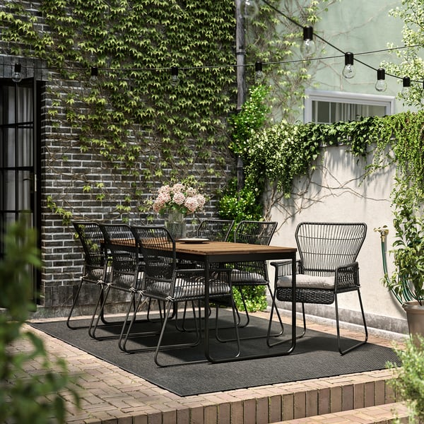 VÄSMAN / TALLSKÄR table+6 chairs w armrests, outdoor, extendable light brown stained/anthracite Kuddarna light grey-beige, 135x190/74 cm