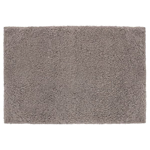 ALMTJÄRN - Bath mat, beige, 60x90 cm