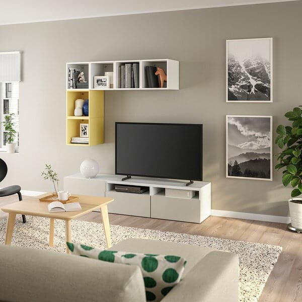 BESTÅ / EKET - Cabinet combination for TV, white/pale yellow, 180x42x170 cm